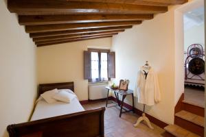 A bed or beds in a room at Poderi Arcangelo