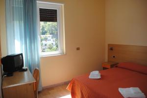 Postel nebo postele na pokoji v ubytování Hotel South Paradise + 37 fotografií