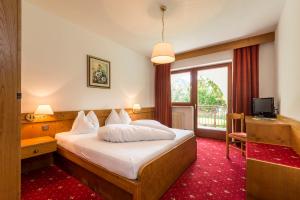 Postel nebo postele na pokoji v ubytování Hotel Panorama