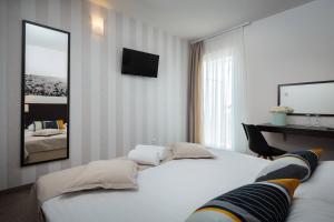 Postel nebo postele na pokoji v ubytování Villas Arausana & Antonina