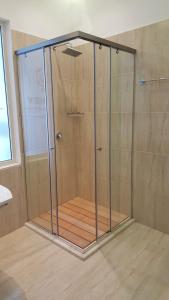 a shower with a glass enclosure in a bathroom at Ventus Harbor Hotel in Durrës