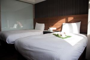 Letto o letti in una camera di KDM Hotel