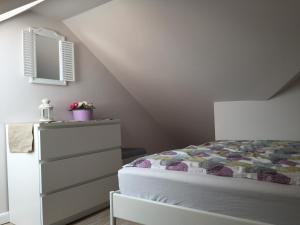 Posteľ alebo postele v izbe v ubytovaní Apartamenty Baltic