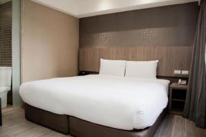 Letto o letti in una camera di KDM Hotel