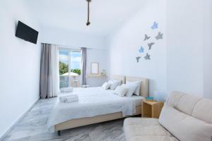 Letto o letti in una camera di Memories Beach Hotel