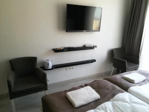 Postel nebo postele na pokoji v ubytování Pruva Prestige Hotel