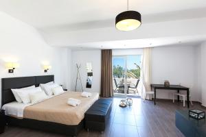 Letto o letti in una camera di Memories Beach Hotel