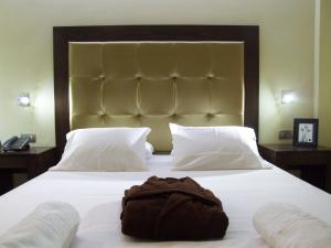 Postel nebo postele na pokoji v ubytování Ellinis Hotel