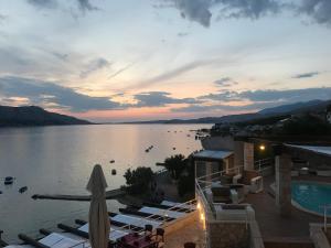 a view of a large body of water at sunset at Hotel Belveder in Pag