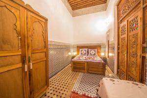 Una cama o camas en una habitación de Riad Ouliya