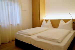 Posteľ alebo postele v izbe v ubytovaní Residence Larciunei