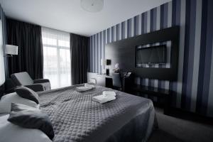 Postel nebo postele na pokoji v ubytování Hotel Grafit