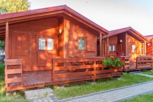 Imagem da galeria de Domki Słoneczko z dostępem do jacuzzi sauny i rowerów em Dźwirzyno