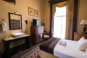 Postel nebo postele na pokoji v ubytování El Gran Hotel