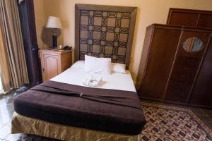 Postel nebo postele na pokoji v ubytování El Gran Hotel