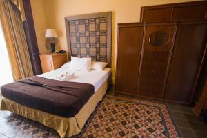 Postel nebo postele na pokoji v ubytování El Gran Hotel