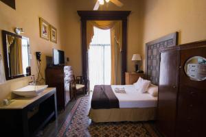 Postel nebo postele na pokoji v ubytování El Gran Hotel