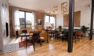 a living room with a table and a dining room at The Publishing House Bed and Breakfast in Chicago
