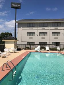 a swimming pool in front of a building at Country Inn & Suites by Radisson, Abingdon, VA in Abingdon