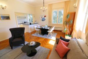 a living room with a couch and a table at Apartment MiraMare on the beach in Split