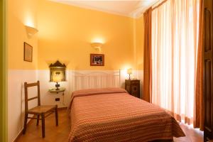 Ένα ή περισσότερα κρεβάτια σε δωμάτιο στο Hotel Mergellina