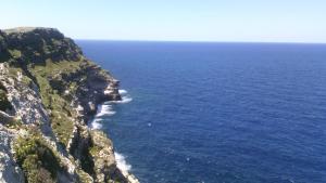 an aerial view of the ocean on a cliff at La Casa Dei Delfini in Lampedusa