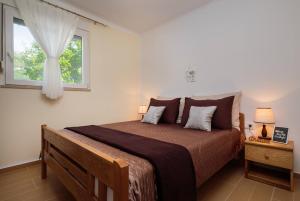 Postel nebo postele na pokoji v ubytování Apartment Krželj