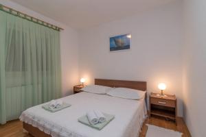 Posteľ alebo postele v izbe v ubytovaní Apartments in Trogir