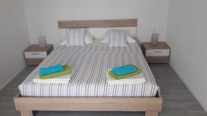 Postel nebo postele na pokoji v ubytování Apartman Marco