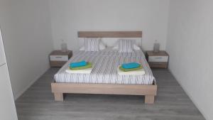 Postel nebo postele na pokoji v ubytování Apartman Marco