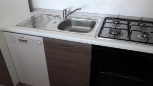 Kuchyň nebo kuchyňský kout v ubytování Apartman Marco