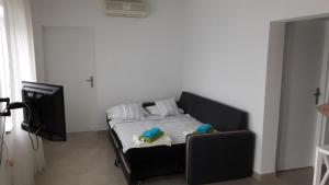 Postel nebo postele na pokoji v ubytování Apartman Marco