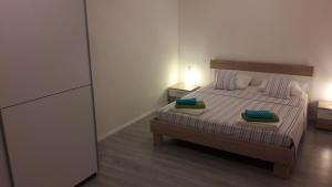 Postel nebo postele na pokoji v ubytování Apartman Marco
