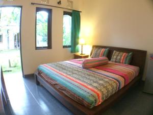Cama o camas de una habitación en Ayu Guest House