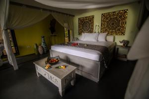 Rúm í herbergi á Zen Resort Bali