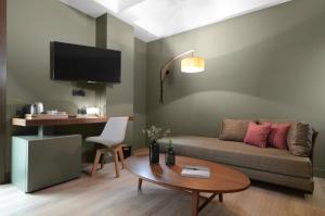 A television and/or entertainment centre at Lake Spirit Boutique Hotel & Spa