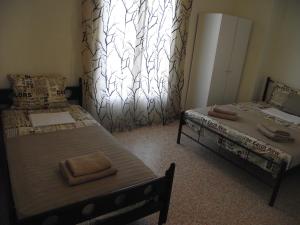 A bed or beds in a room at Sfiggos 54 Guest House
