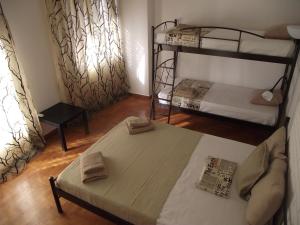 A bed or beds in a room at Sfiggos 54 Guest House