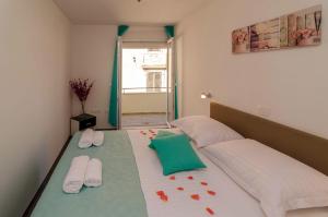 מיטה או מיטות בחדר ב-Apartments Silvia