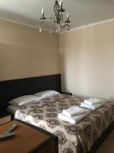 Кровать или кровати в номере Guest House Stariy Dvorik