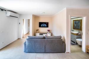 Televízia a/alebo spoločenská miestnosť v ubytovaní Emma appartment