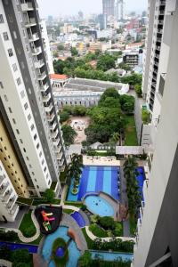 an overhead view of a pool between two buildings at SkyLounge Apartment 2 Colombo in Colombo