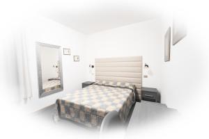 Postel nebo postele na pokoji v ubytování Hotel I Tigli albergo diffuso