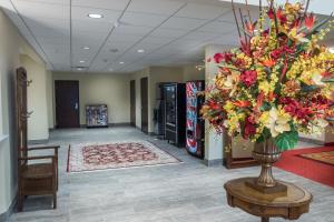a lobby with a vase of flowers on a table at Skyline Hotel and Casino in Las Vegas +37 photos