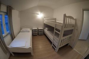 Postel nebo postele na pokoji v ubytování Apartments Leut