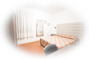 Postel nebo postele na pokoji v ubytování Hotel I Tigli albergo diffuso