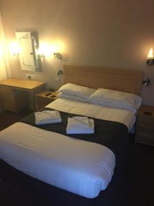 Letto o letti in una camera di Sutherland House