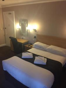 Letto o letti in una camera di Sutherland House