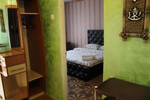 a small room with a bed and a chair at Apartment on Fastivs'ka 2 in Bila Tserkva