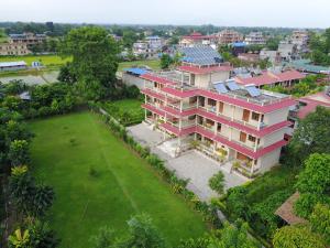 an aerial view of a house with a yard at Chitwan Forest Resort , Chitwan National Park in Sauraha